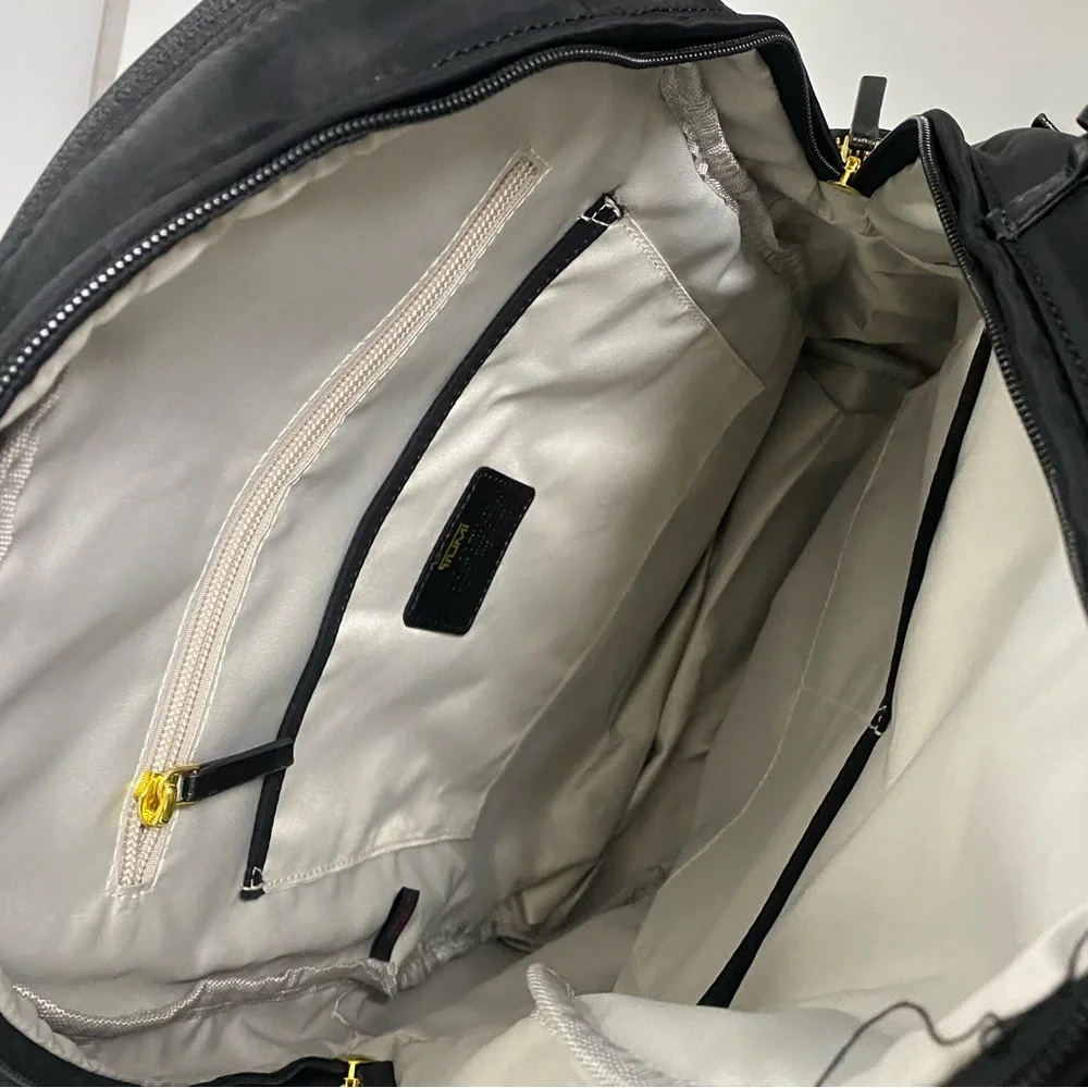 Tumi Black Backpack with Gold Zippers